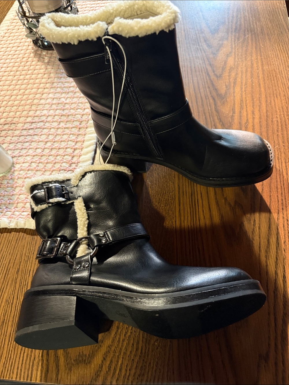 Black memory foam cuff is faux fur lined boot with slight heal